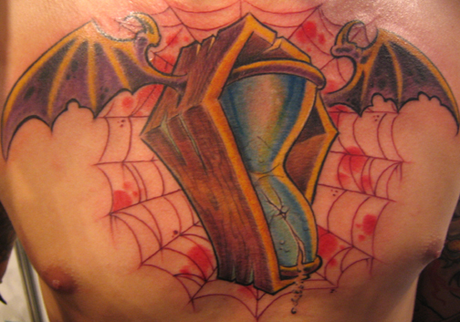 Looking for unique  Tattoos? hour glass in coffin tattoo